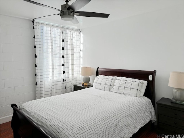 bedroom with dark wood finished floors and a ceiling fan