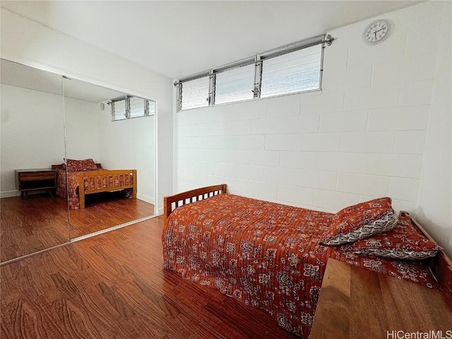 bedroom featuring wood finished floors