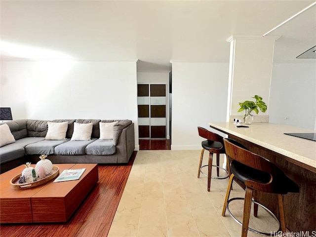 living room featuring light wood-style floors and ornamental molding