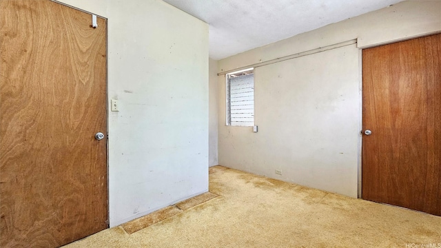 unfurnished bedroom featuring carpet