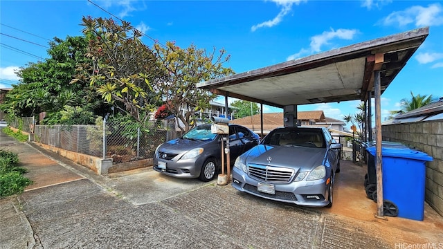 view of parking / parking lot featuring a carport