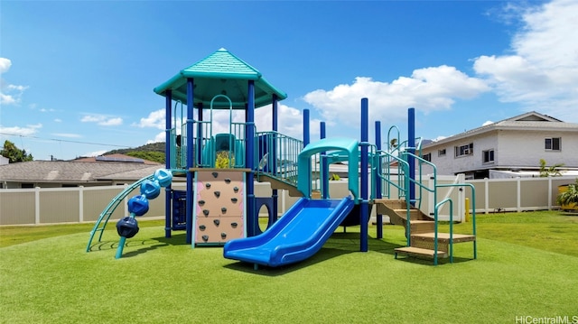 view of jungle gym featuring a yard