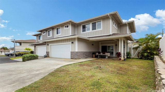 view of front of home featuring a front yard and a garage