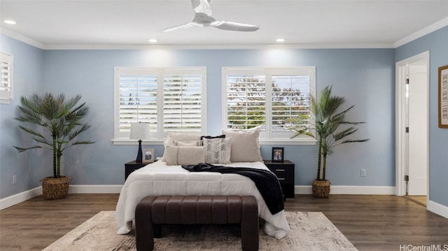 bedroom featuring ornamental molding, dark hardwood / wood-style floors, and ceiling fan