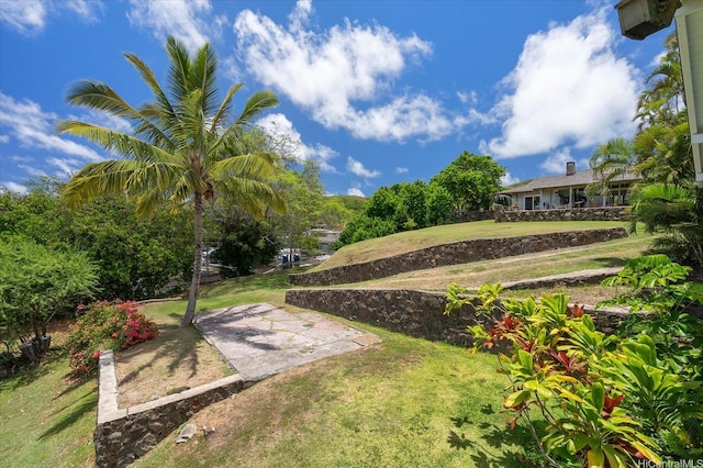 44-519 Kaneohe Bay Dr, Kaneohe, HI 96744 - view of grassy yard with a patio