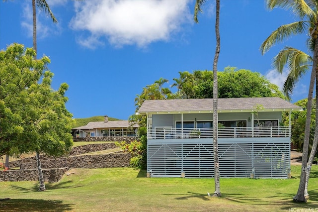 44-519 Kaneohe Bay Dr, Kaneohe, HI 96744 - view of property exterior with a lawn