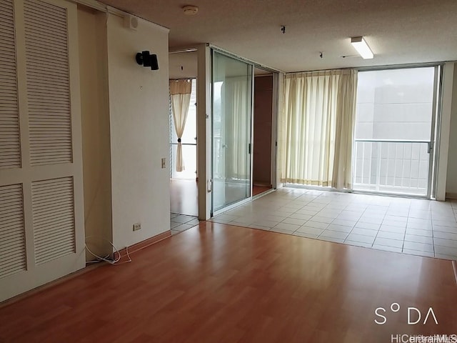 spare room featuring light hardwood / wood-style floors