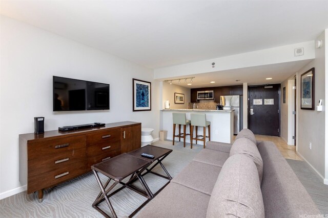 1777 Ala Moana Blvd Unit 207, Honolulu, HI 96815 - living area with light carpet and baseboards