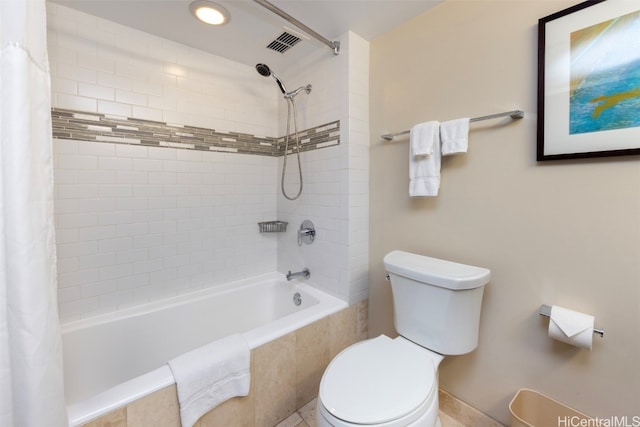 bathroom featuring toilet and shower / bathtub combination with curtain