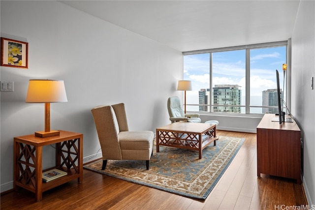 living area with hardwood / wood-style flooring