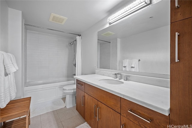 full bathroom with vanity, shower / bath combo with shower curtain, toilet, and tile patterned floors