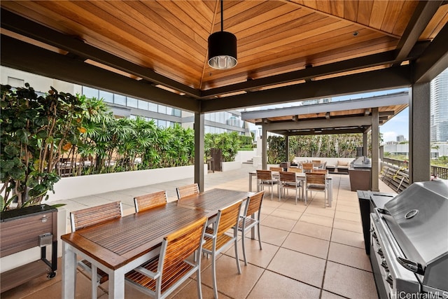 view of patio featuring a grill and an outdoor hangout area