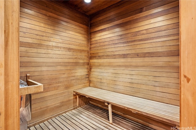 view of sauna featuring wood walls