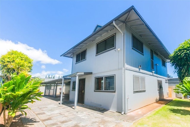 view of side of home featuring a patio area