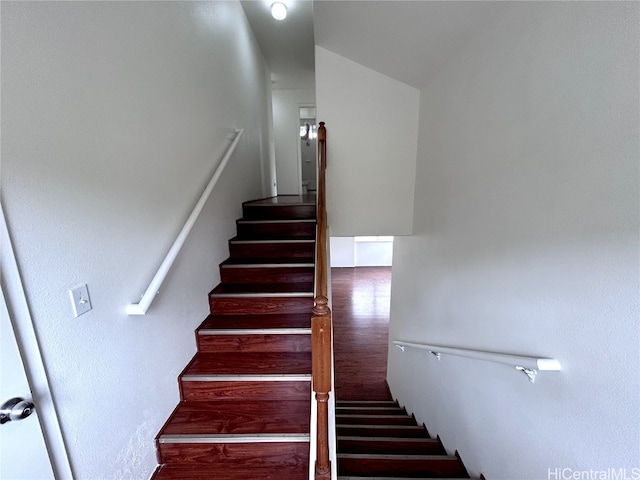 stairs with lofted ceiling