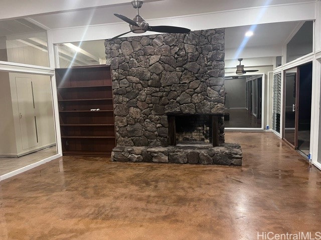 unfurnished living room featuring a fireplace and concrete floors