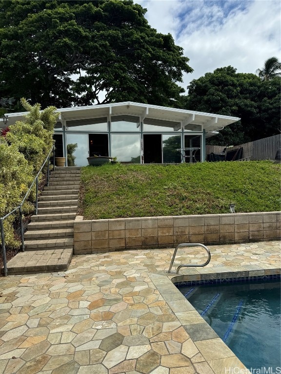 exterior space with a patio and a fenced in pool