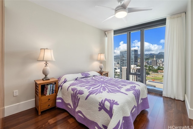 bedroom featuring dark hardwood / wood-style flooring and ceiling fan