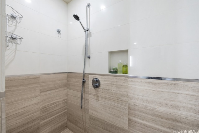 bathroom with tiled shower