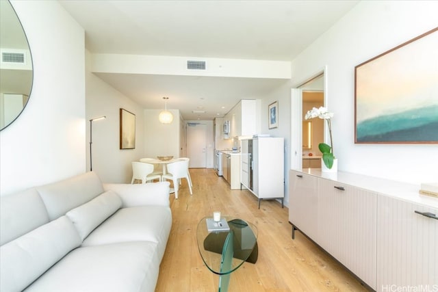 living room with light hardwood / wood-style flooring