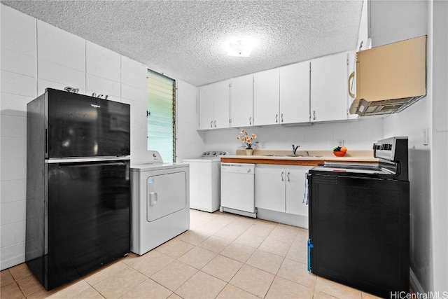 kitchen featuring washer and clothes dryer, white cabinetry, sink, and black appliances