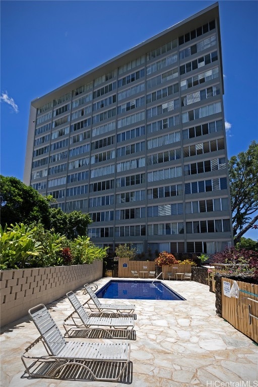 view of swimming pool with a patio area