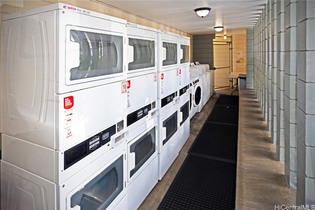 interior space featuring stacked washer / dryer and washer and clothes dryer