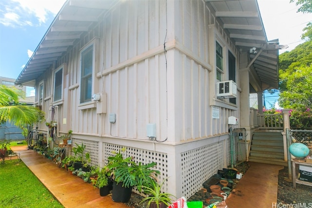 view of side of home featuring cooling unit