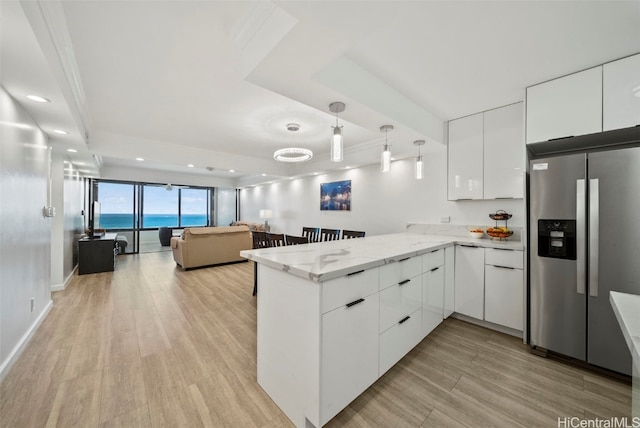 kitchen featuring white cabinetry, light hardwood / wood-style flooring, kitchen peninsula, and stainless steel refrigerator with ice dispenser