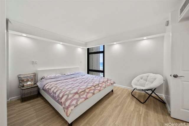 bedroom featuring hardwood / wood-style flooring