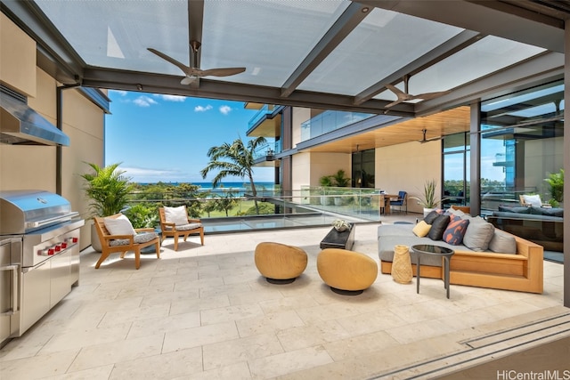 view of patio with area for grilling, a balcony, an outdoor hangout area, ceiling fan, and a water view