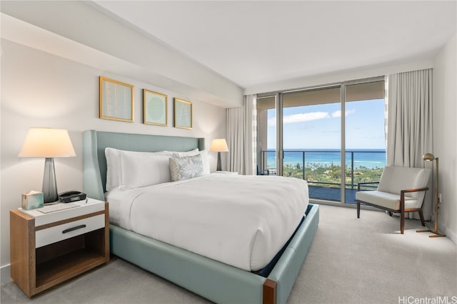 bedroom featuring floor to ceiling windows, access to exterior, light colored carpet, and a water view