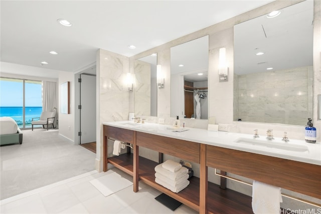 bathroom featuring vanity and a water view