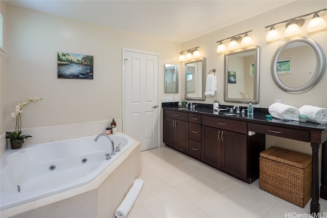 bathroom featuring vanity and tiled bath