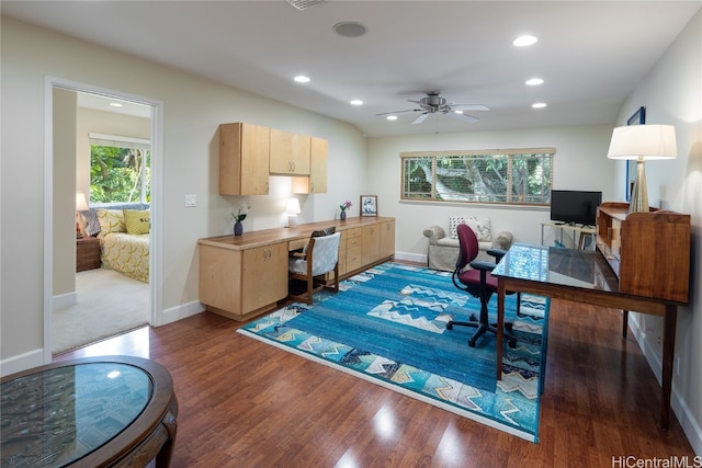 office space with ceiling fan and dark hardwood / wood-style flooring