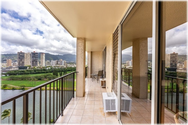 balcony with a water and mountain view