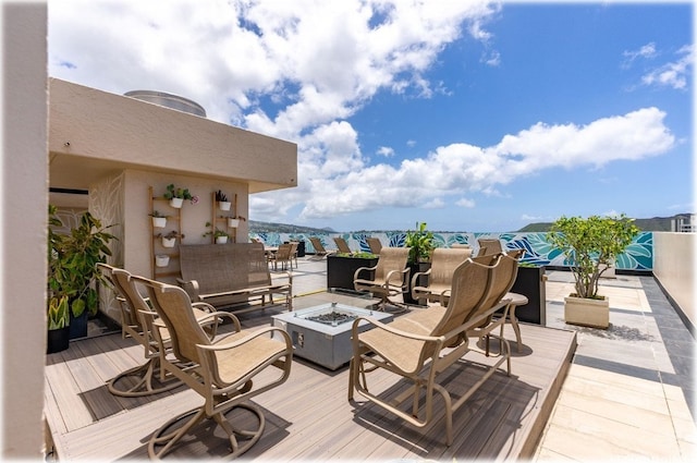 deck featuring an outdoor fire pit