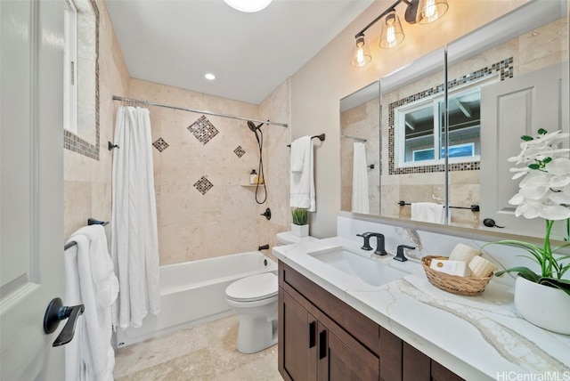 full bathroom featuring shower / bath combination with curtain, toilet, and vanity