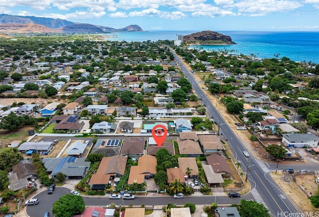 drone / aerial view featuring a water and mountain view