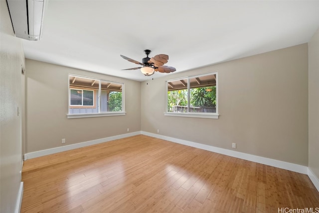 spare room featuring ceiling fan and light hardwood / wood-style floors