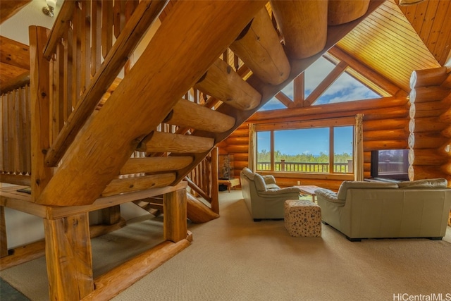 living room featuring high vaulted ceiling, carpet flooring, and rustic walls