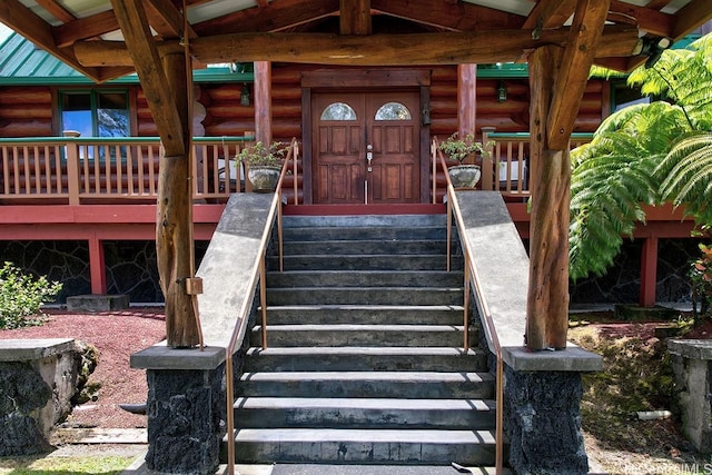 16-1125 Poouli Rd, Kurtistown, HI 96760 - property entrance with log siding and metal roof