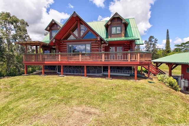 16-1125 Poouli Rd, Kurtistown, HI 96760 - rear view of property featuring log exterior, a deck, a lawn, and metal roof
