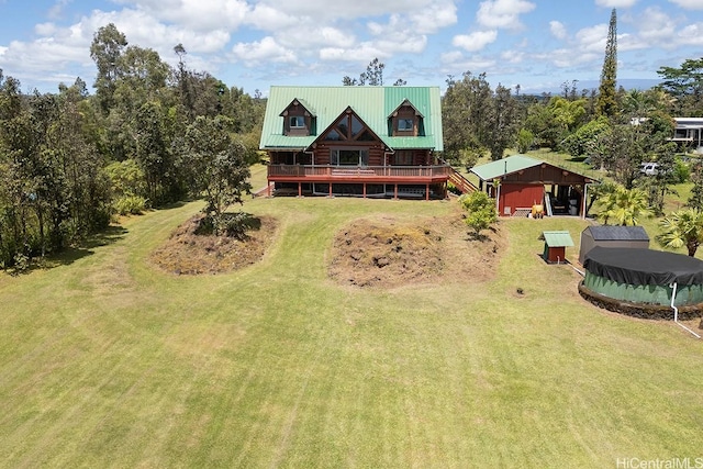 16-1125 Poouli Rd, Kurtistown, HI 96760 - back of house featuring a yard, a wooden deck, and metal roof