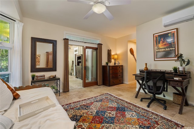 bedroom with ceiling fan, baseboards, and a wall unit AC
