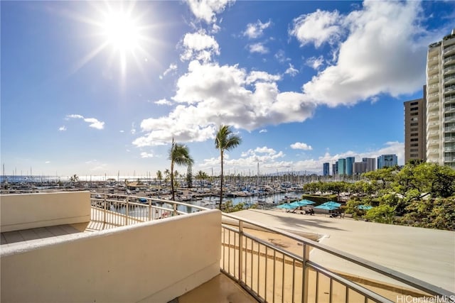 balcony featuring a water view