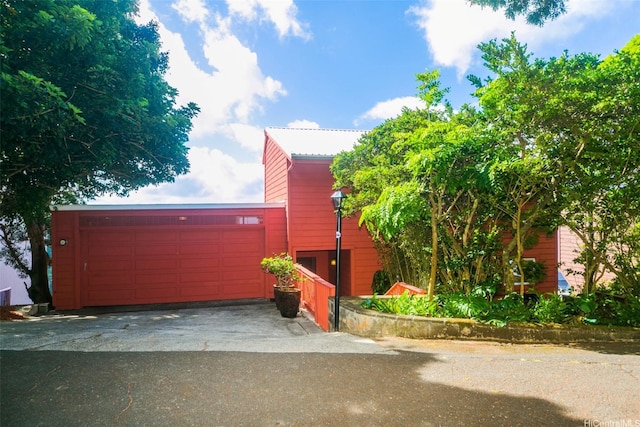 garage with aphalt driveway
