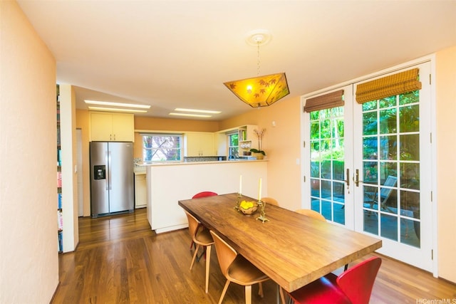 dining room featuring french doors and dark wood-style floors