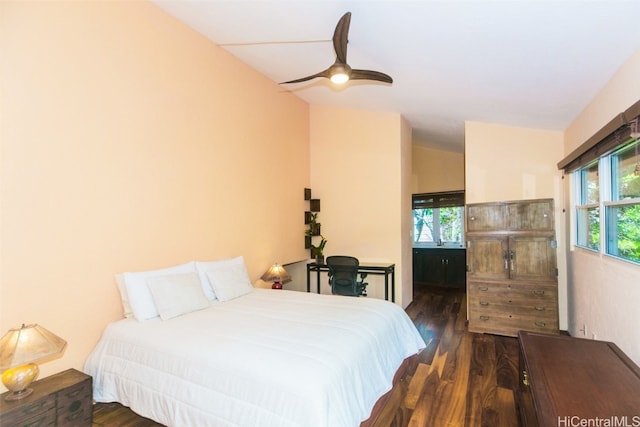 bedroom with dark wood-type flooring and ceiling fan