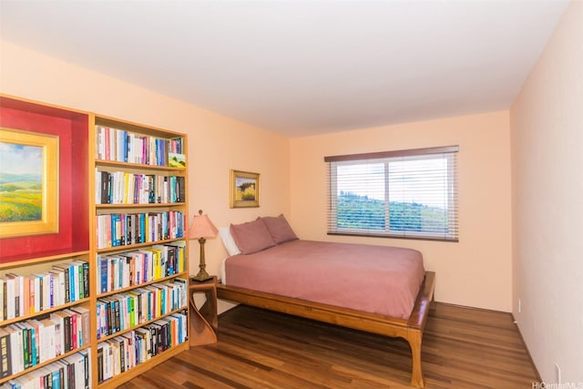 bedroom with wood finished floors